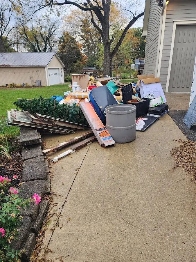 Dumpster being loaded with debris for 3 Yard Dumpster Rental in Auburn Lake Trails
